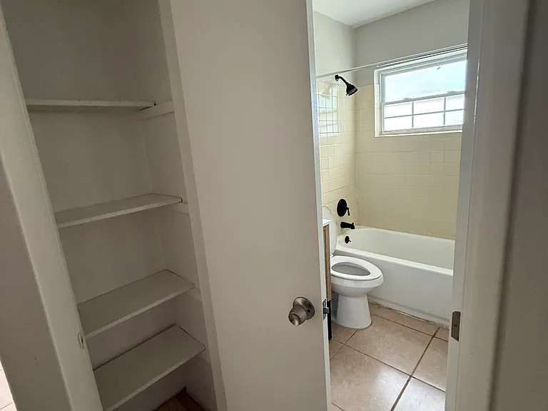 Closet outside of the bathroom