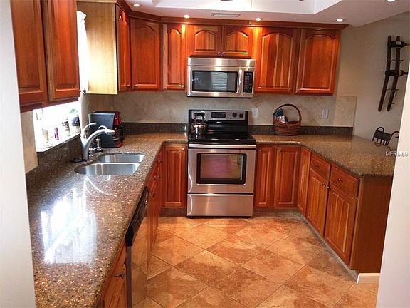 The Cooks delight-Beautiful cherry wood cabinetry, new lighting, tiled flooring and stainless appliances.