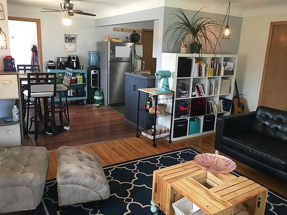 Upstairs living room from another perspective, eat in kitchen (*note* floor has been updated since this photo)