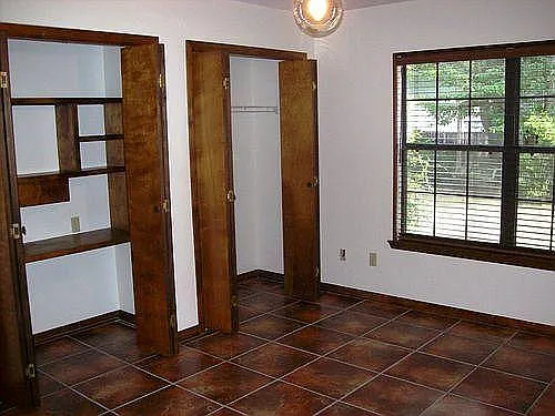 Master bedroom with two closets, One with built in desk