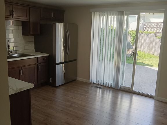 Sliding door to patio and private backyard.