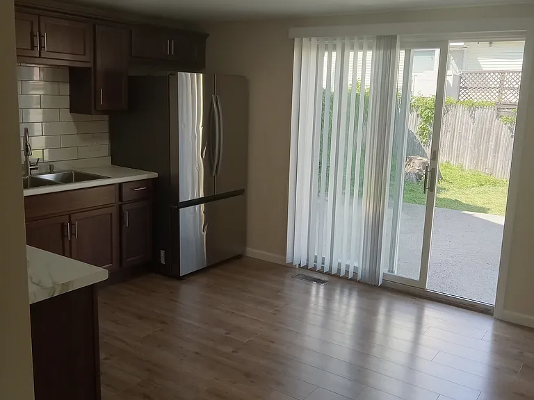 Sliding door to patio and private backyard.