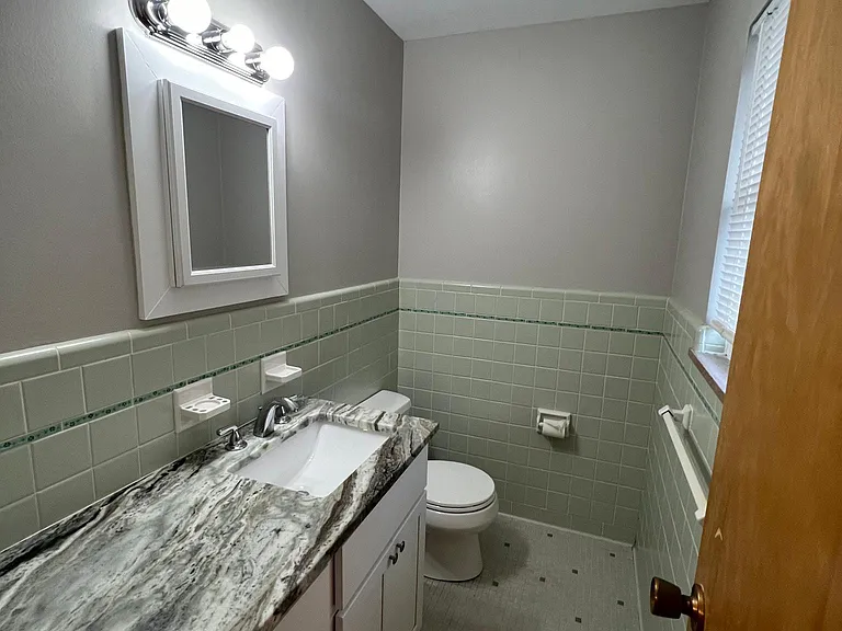 Main bedroom half bath with large vanity