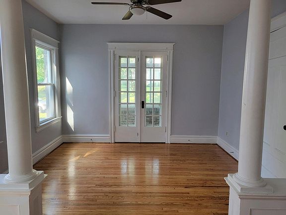 dining room and French doors leads to 3 season front porch