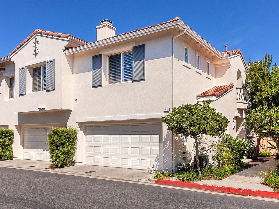 39 Avenida Brio, SC Front of unit with side entrance, two car garage & entertaining deck. Unit is one level once entering and going upstairs.