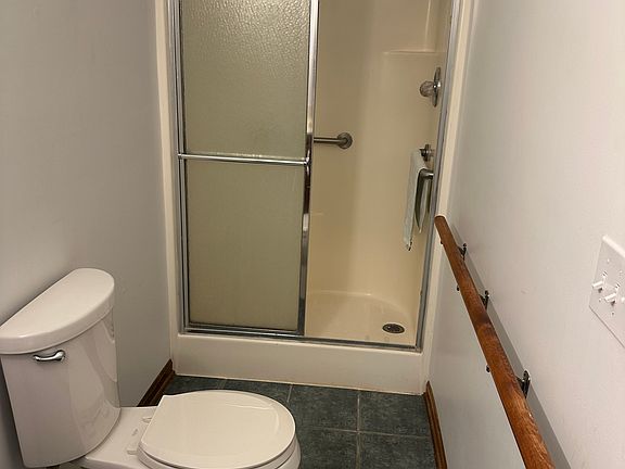 Bathroom at rear of utility room. Has stand up shower (no bathtub).