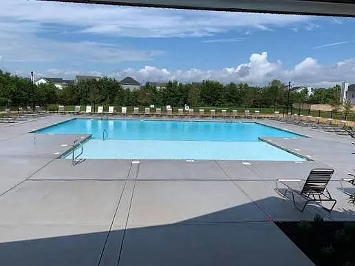 Large junior-Olympic community swimming pool at community club house