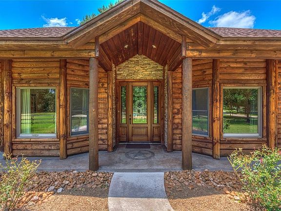 Rich entry features a gorgeous Solid Wood Mahogany Leaded Glass Door!