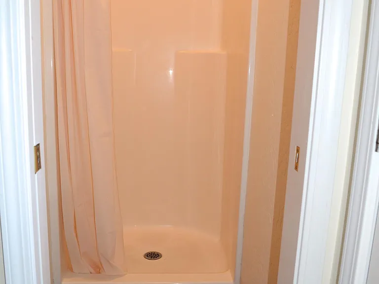 Shower is in it's own designated room.