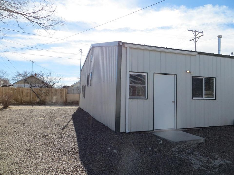 Front entrance, parking in front of door and side of buildin