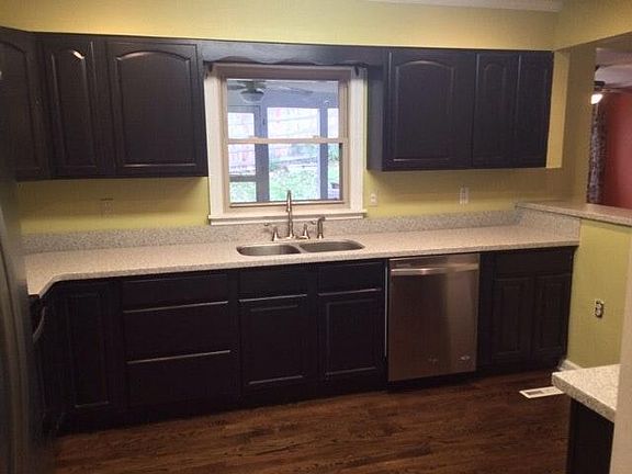 Remodeled kitchen with solid surface countertops