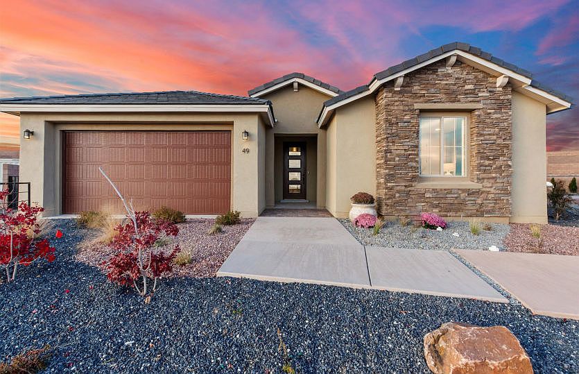 Parklane model home showcasing the stone veneer and painted garage door exterior for enhanced curb a