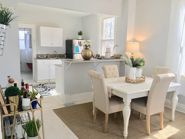 Open floor plan between kitchen and dining room.