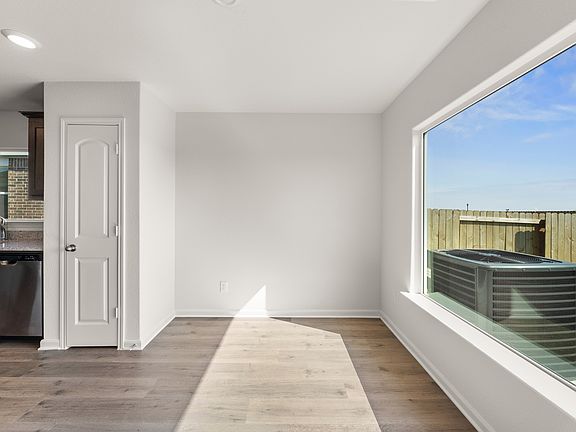 The dining room has a large window that lets in great, natural light.