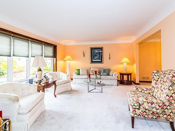 Spacious living room provides great space for guests to congregate for a pleasant visit.