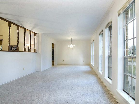 You'll love the formal living and dining room as you enter the home. Wall of windows allows plenty o