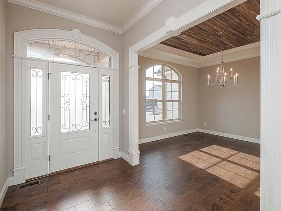 Front Entry and Dining Room with custom trim work!