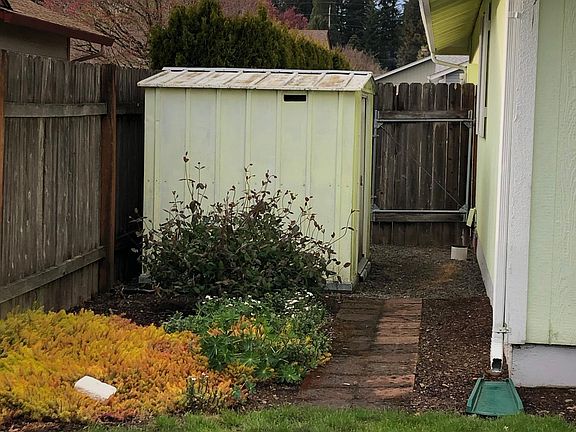 Side yard. 1 of 3 metal storage sheds