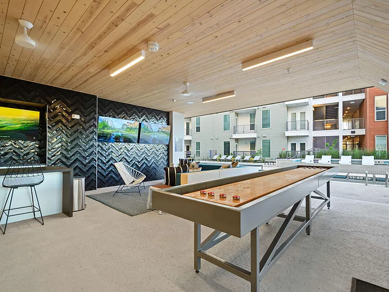 Covered Poolside Sports Lounge with TVs and Shuffleboard