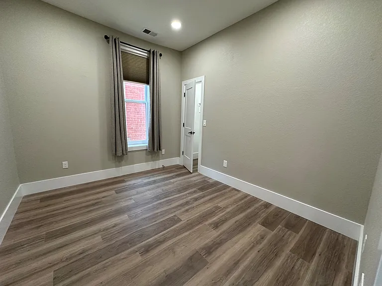 Large bedroom with high ceilings and walk in closet
