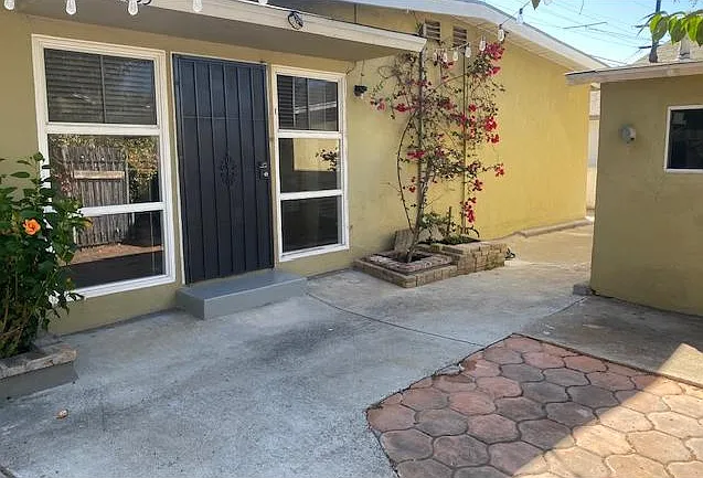 Entry with private courtyard. Bldg. on right is private laundry room.