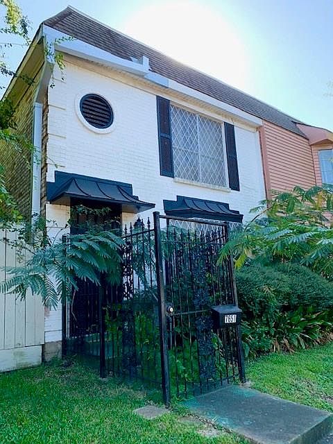 Two story townhome, 1,590 sq/ft with lots of potential. Gated entrance and gated parking. Corner lot, so only one neighbor. Investors, this is a deal!