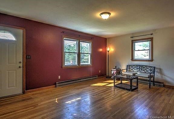 Spacious living room with hardwood floor!