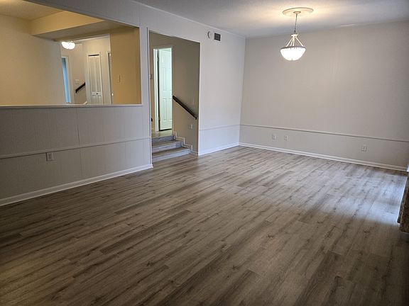 The extra large living room opens to the screened porch and back deck and includes a gas burning fireplace.