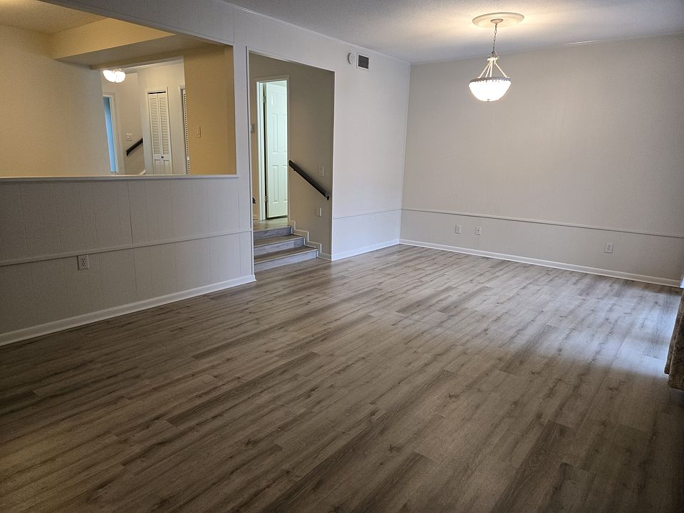 The extra large living room opens to the screened porch and back deck and includes a gas burning fireplace.