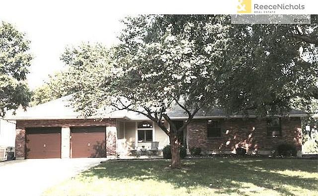 Newly painted exterior with relaxing front patio and newly lands