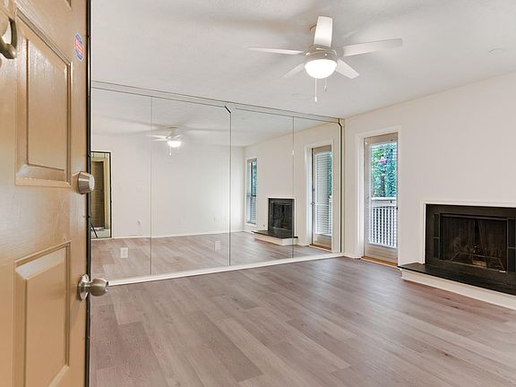 Living Room area with fireplace and door to balcony