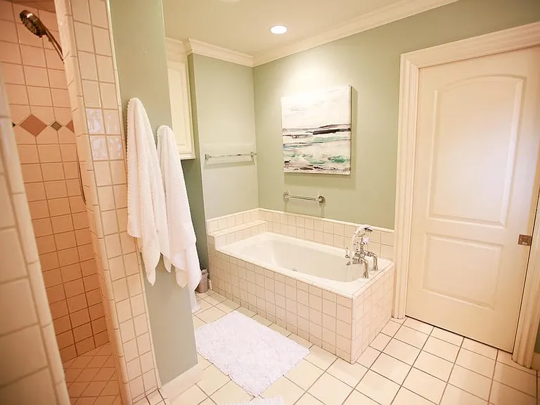 Separate walk-in shower and full bathtub with jets for decompressing.