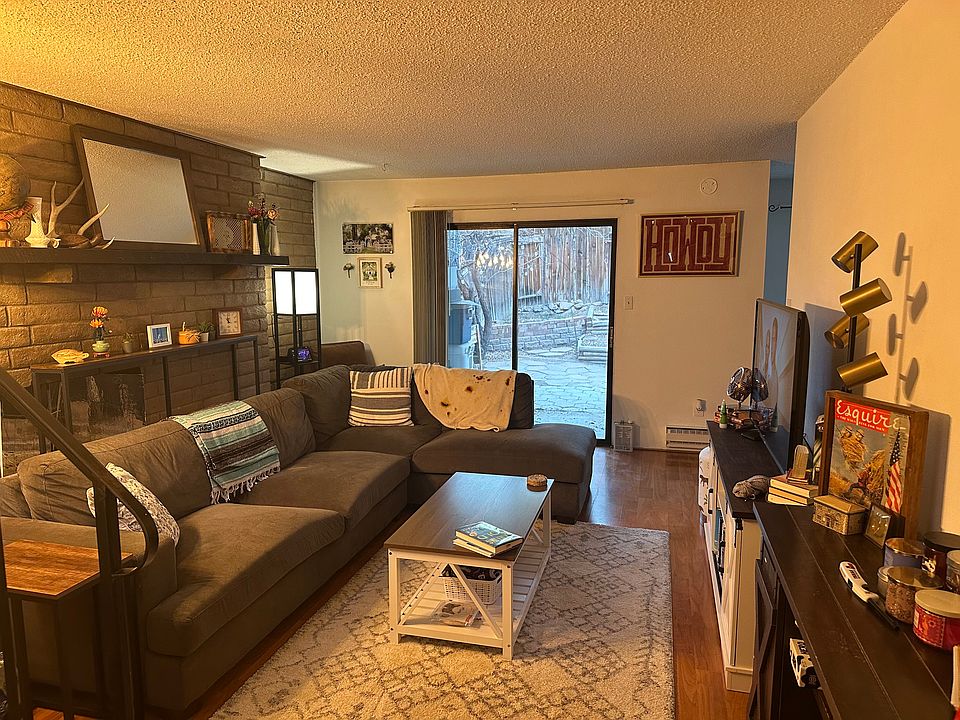 Living room leads to private backyard.
