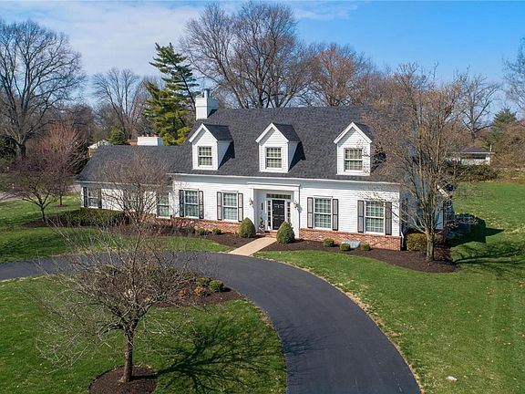 Circle drive and charming entry provide impressive street presence.