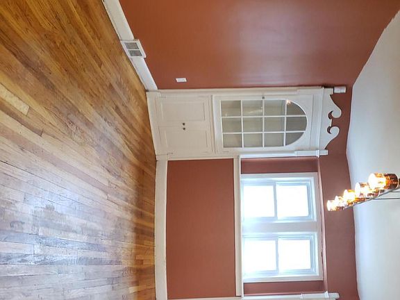 Prior to refinishing the floor.