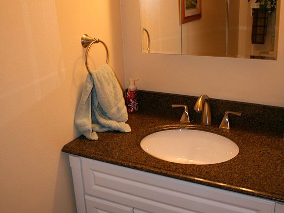 Small 1/2 bath under the stairs.