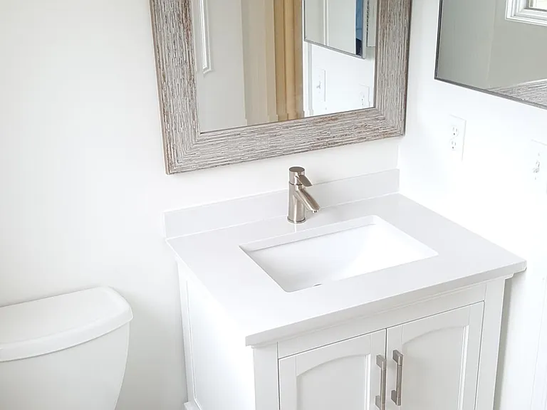 2nd bedroom bath, right off bedroom at end of hall.