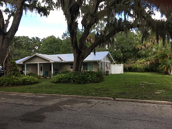 Wonderful Old Oak trees shade this corner home
