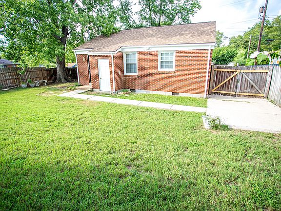 Backyard - The backyard is fully fenced in and has gates/access on both sides of the corner lot.
