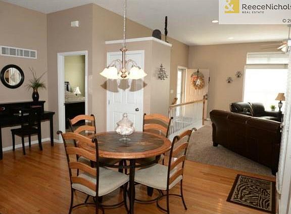Dining area with gleaming hardwood floor.