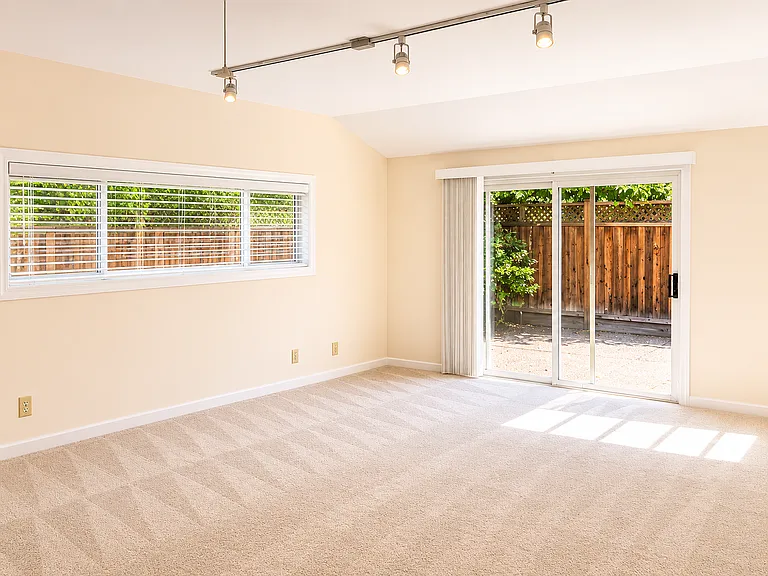 Bonus room (converted garage) with sliding door to patio.