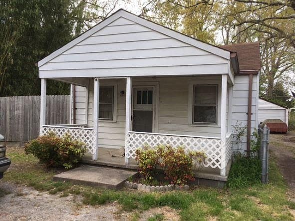 Cottage like with comfortable front porch.
