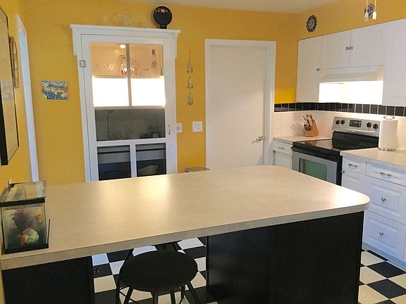 Wonderful workspace and seating area....roll out the cookie dough! There's a cool pantry on the back