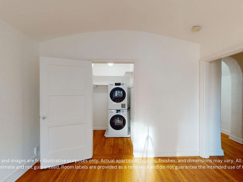 Interior view of an apartment featuring a laundry area with stacked washer and dryer, and wooden flooring.