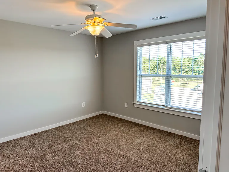 The secondary (or guest) bedroom has an attached bathroom and double door closet.