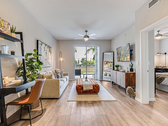 Open Layout with Living Room, Sliding Glass Door, and Work Desk