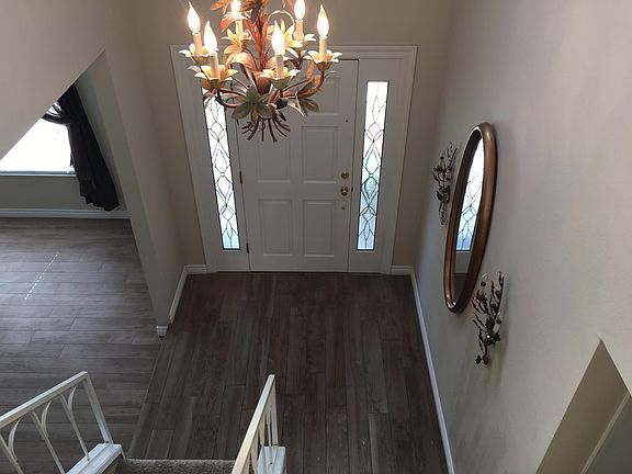 Entry view showing upgraded wood tile flooring.