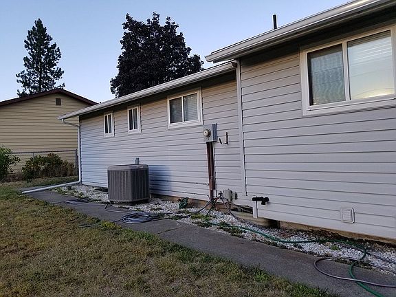 Backyard and heat pump.