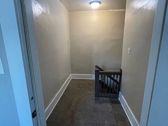 Nice hallway leading into apartment with extra storage room