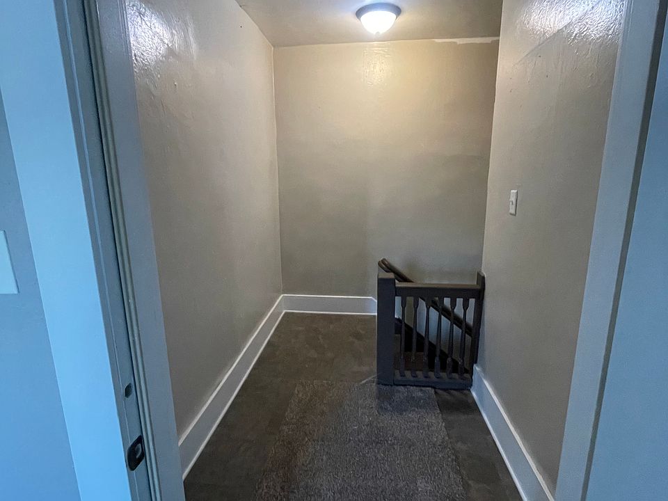 Nice hallway leading into apartment with extra storage room